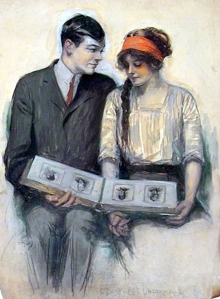 Young Couple Looking At Photo Album by Clarence Underwood